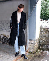 Wrap yourself in elegance with this vintage 80s 90s black real fur coat. This timeless piece adds a touch of luxury to any outfit. 