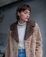 Wrap yourself in luxury with this premium vintage 70s brown real fur jacket! With its timeless design and XS size, you will stay cozy all winter long!