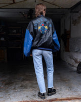 Unleash your inner rebel with this Vintage 80s Uncle Sam bomber leather jacket in size XL. Featuring a laid back, old-school vibe, this jacket exudes coolness and effortless style