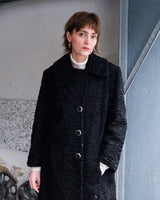 Wrap yourself in elegance with this vintage 80s 90s black real fur coat. This timeless piece adds a touch of luxury to any outfit. 