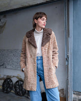 Wrap yourself in luxury with this premium vintage 70s brown real fur jacket! With its timeless design and XS size, you will stay cozy all winter long!