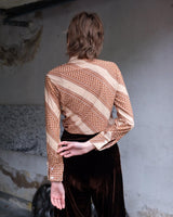 Get groovy with this vintage 70s brown dotted blouse in XS! Bring some playful vibes to your wardrobe with this unique throwback piece.