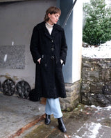 Wrap yourself in elegance with this vintage 80s 90s black real fur coat. This timeless piece adds a touch of luxury to any outfit. 