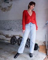 Add a pop of elegance to any outfit with this vintage 80s red cable knit cardigan. The statement red color makes a bold fashion statement.
