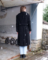 Wrap yourself in elegance with this vintage 80s 90s black real fur coat. This timeless piece adds a touch of luxury to any outfit. 