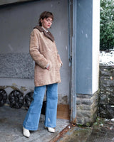 Wrap yourself in luxury with this premium vintage 70s brown real fur jacket! With its timeless design and XS size, you will stay cozy all winter long!