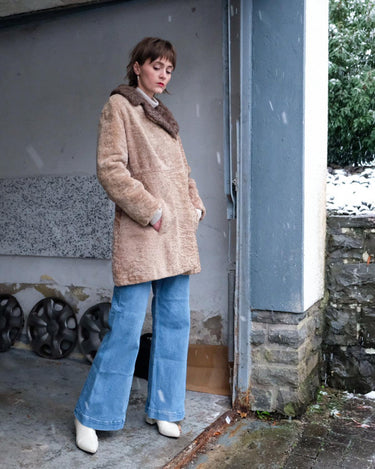 Wrap yourself in luxury with this premium vintage 70s brown real fur jacket! With its timeless design and XS size, you will stay cozy all winter long!