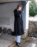 Wrap yourself in elegance with this vintage 80s 90s black real fur coat. This timeless piece adds a touch of luxury to any outfit. 