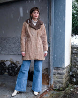 Wrap yourself in luxury with this premium vintage 70s brown real fur jacket! With its timeless design and XS size, you will stay cozy all winter long!