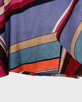 This Y2k skirt serves pure elegance with its flowing silhouette and vibrant geometric print in magenta, teal, orange, and warm brown. Light and easy to wear, it’s comfortable and anything but boring—designed for those who dress with intention.