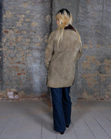 Experience the ultimate warmth and coziness in our Vintage 80s brown shearling coat! This timeless piece, available in XXS - XS, will keep you snug and stylish all winter long. Say "bye-bye" to cold weather!