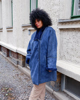 Cozy up like it's the 80s with this vintage navy blue shearling coat. Perfect for colder days! Get your winter fashion game on point.