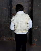 Rare 80s collab between French art rebel Castelbajac and Italian luxury label ICEBERG. A bold mix of soft knit sleeves and lightweight woven fabric, detailed with silver snaps and zip pockets. Playful, offbeat, and seriously collectible.
