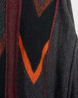 Get ready to embrace some 90s vibes with this vintage grey and orange geometric pattern sweater! Perfect for a cozy look!