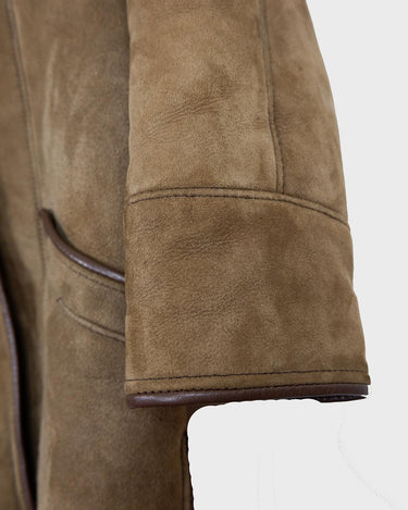 Experience the ultimate warmth and coziness in our Vintage 80s brown shearling coat! This timeless piece, available in XXS - XS, will keep you snug and stylish all winter long. Say "bye-bye" to cold weather!