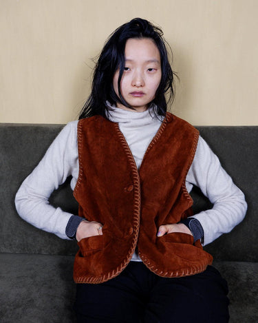 Introducing our vintage 90s brown leather vest with its stitching details, perfect for the XS-S sized leather vest lover. This piece adds a touch of boho vibes to any outfit, while the authentic leather material provides durability and style. Don't miss out on this one-of-a-kind addition to your wardrobe!