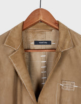 y2k brown leather jacket with white sewing details.