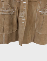 y2k brown leather jacket with white sewing details.