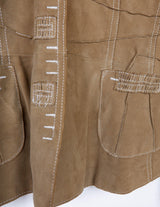 y2k brown leather jacket with white sewing details.