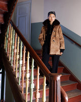 Stay cozy with our premium vintage 80s knitter optic jacket. With a real fur lining (except the sleeves) and collar, this jacket provides ultimate warmth!