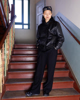 This Vintage 80s black leather jacket is the ultimate classic, complete with press buttons, structured vibes, and smooth leather.