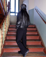 This Vintage 80s black leather jacket is the ultimate classic, complete with press buttons, structured vibes, and smooth leather.
