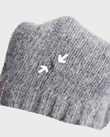 Get cozy in this vintage 90s grey lambswool angora turtleneck sweater (thin), with a fun geometric pattern. Made with a mix of lambswool and angora and a bit polyamid, this sweater will keep you warm. Its long fit offers versatility and the turtleneck adds a touch of elegance. Perfect for chilly days!