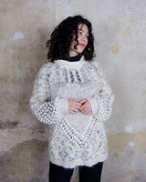 This Italian-made sweater is a premium vintage piece from the iconic 80s era. Handmade with care, this white sweater is a must-have addition to your wardrobe. 
