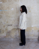 This Italian-made sweater is a premium vintage piece from the iconic 80s era. Handmade with care, this white sweater is a must-have addition to your wardrobe. 