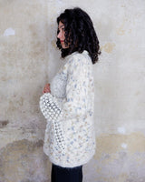 This Italian-made sweater is a premium vintage piece from the iconic 80s era. Handmade with care, this white sweater is a must-have addition to your wardrobe. 
