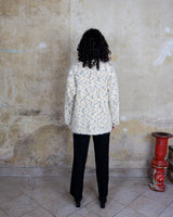 This Italian-made sweater is a premium vintage piece from the iconic 80s era. Handmade with care, this white sweater is a must-have addition to your wardrobe. 