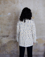 This Italian-made sweater is a premium vintage piece from the iconic 80s era. Handmade with care, this white sweater is a must-have addition to your wardrobe. 