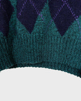 Stay cozy and classy in this vintage 90s green argyle sweater. Perfect for sizes M-L, this sweater features a classic argyle pattern and a pop of playful green