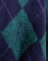 Stay cozy and classy in this vintage 90s green argyle sweater. Perfect for sizes M-L, this sweater features a classic argyle pattern and a pop of playful green