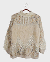 This Italian-made sweater is a premium vintage piece from the iconic 80s era. Handmade with care, this white sweater is a must-have addition to your wardrobe. 