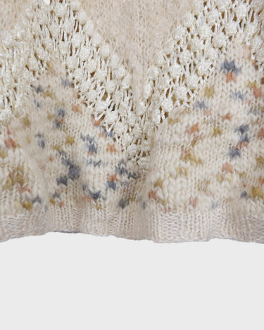 This Italian-made sweater is a premium vintage piece from the iconic 80s era. Handmade with care, this white sweater is a must-have addition to your wardrobe. 