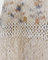 This Italian-made sweater is a premium vintage piece from the iconic 80s era. Handmade with care, this white sweater is a must-have addition to your wardrobe. 