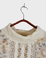 This Italian-made sweater is a premium vintage piece from the iconic 80s era. Handmade with care, this white sweater is a must-have addition to your wardrobe. 