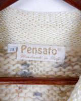 This Italian-made sweater is a premium vintage piece from the iconic 80s era. Handmade with care, this white sweater is a must-have addition to your wardrobe. 