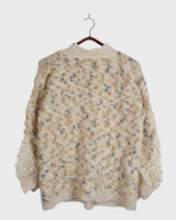 This Italian-made sweater is a premium vintage piece from the iconic 80s era. Handmade with care, this white sweater is a must-have addition to your wardrobe. 