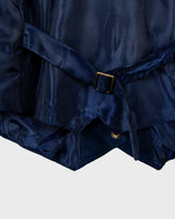 Introducing our latest obsession: a vintage 80s navy blue leather vest with unique stitching at the collar. Who doesn't love a good leather vest? Perfect for adding some edge to any outfit.