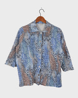 Revive the funky fashion of the 80s with our Vintage 80s 3/4 Sleeve Shirt. In blue with a colorful crazy pattern, it's also knitted with fine, soft fabric for comfort. Available in S-M. Get your groove on!