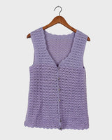 Add a pop of color to your wardrobe with this hand-crocheted purple vest. Made with love and perfect for layering, its long fit will give you an effortlessly look.