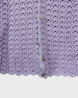 Add a pop of color to your wardrobe with this hand-crocheted purple vest. Made with love and perfect for layering, its long fit will give you an effortlessly look.