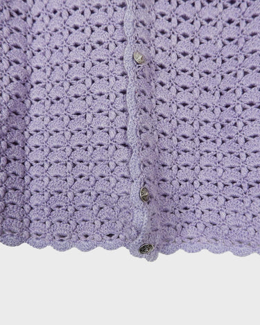 Add a pop of color to your wardrobe with this hand-crocheted purple vest. Made with love and perfect for layering, its long fit will give you an effortlessly look.