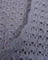 Add a pop of color to your wardrobe with this hand-crocheted purple vest. Made with love and perfect for layering, its long fit will give you an effortlessly look.
