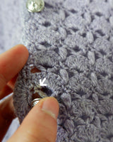 Add a pop of color to your wardrobe with this hand-crocheted purple vest. Made with love and perfect for layering, its long fit will give you an effortlessly look.
