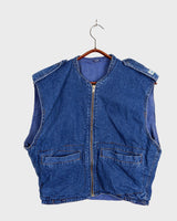 Calling all denim lovers! This vintage 80s blue denim zip vest is sure to elevate your style. A must-have for any wardrobe, this vest is perfect for showing off your love of denim. Zip it up!
