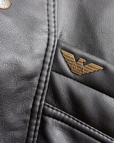 Experience timeless style with this Vintage 80s black faux leather shearling coat, featuring a warm lining that will keep you cozy. Just a heads up, the sleeves are not lined for extra warmth.