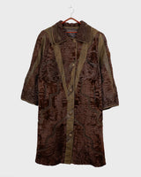 Add a touch of eccentricity to your wardrobe with this vintage 80s long brown leather fur coat. Featuring unique patchwork leather and a cozy fur lining, this XL-XXL coat is perfect for making a bold statement